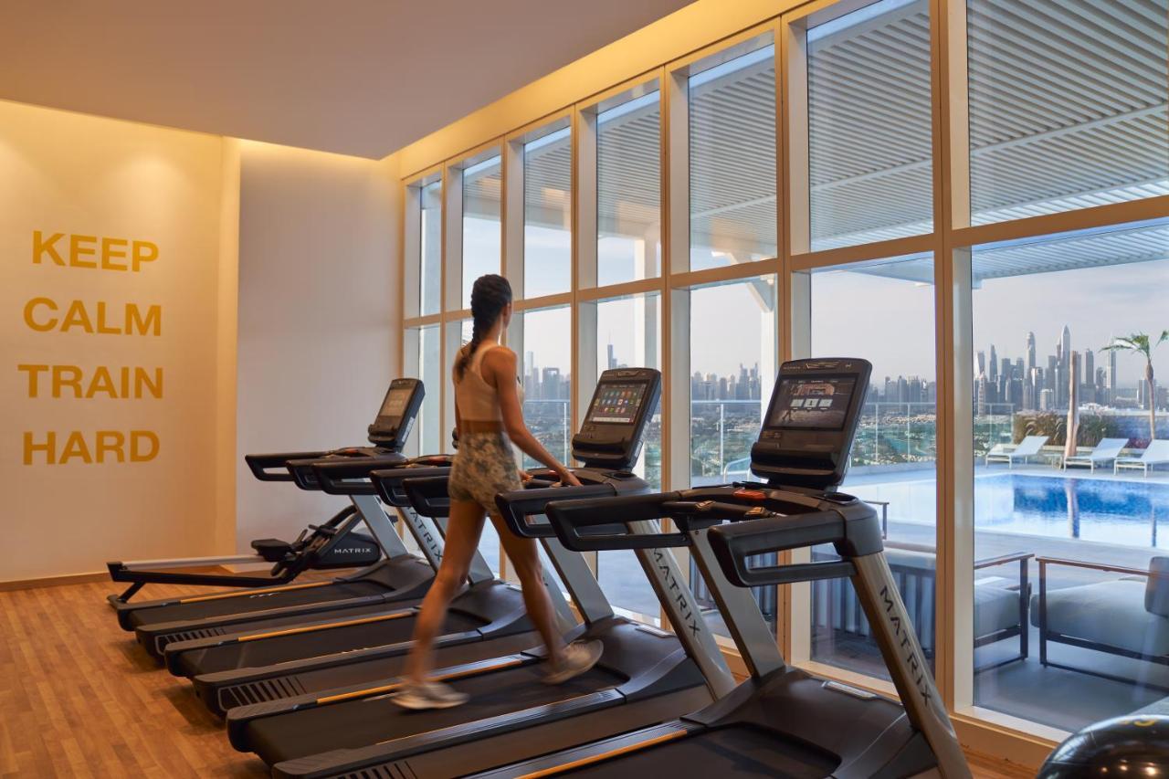 Movenpick Jumeirah Village Triangle Dubai Buitenkant foto The gym at the hotel