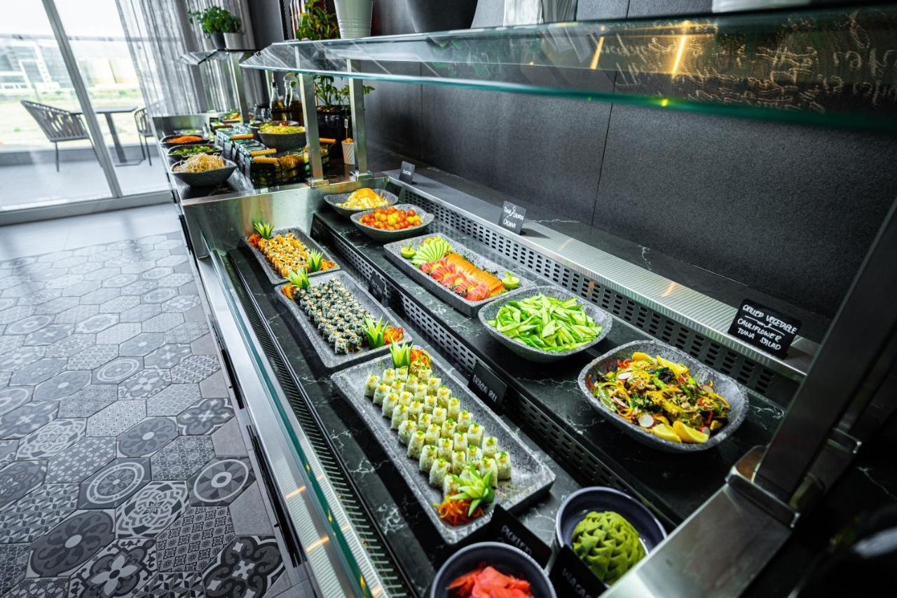 Movenpick Jumeirah Village Triangle Dubai Buitenkant foto A salad bar