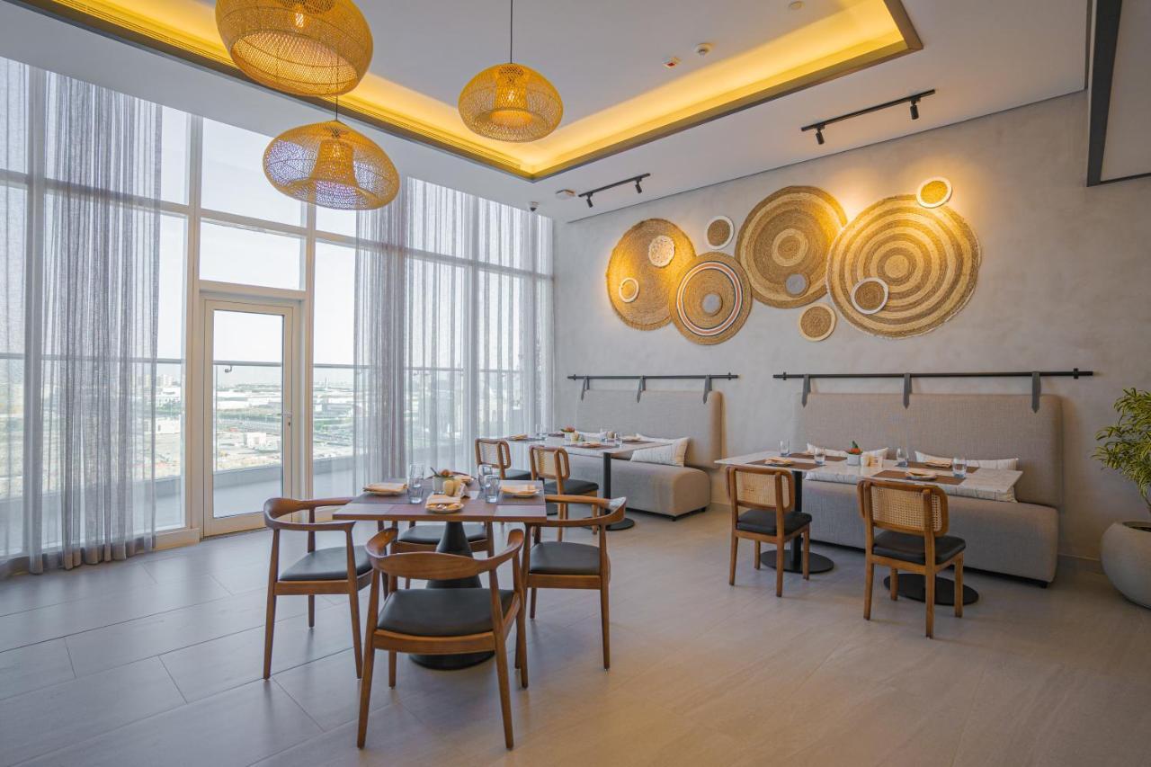 Movenpick Jumeirah Village Triangle Dubai Buitenkant foto The restaurant