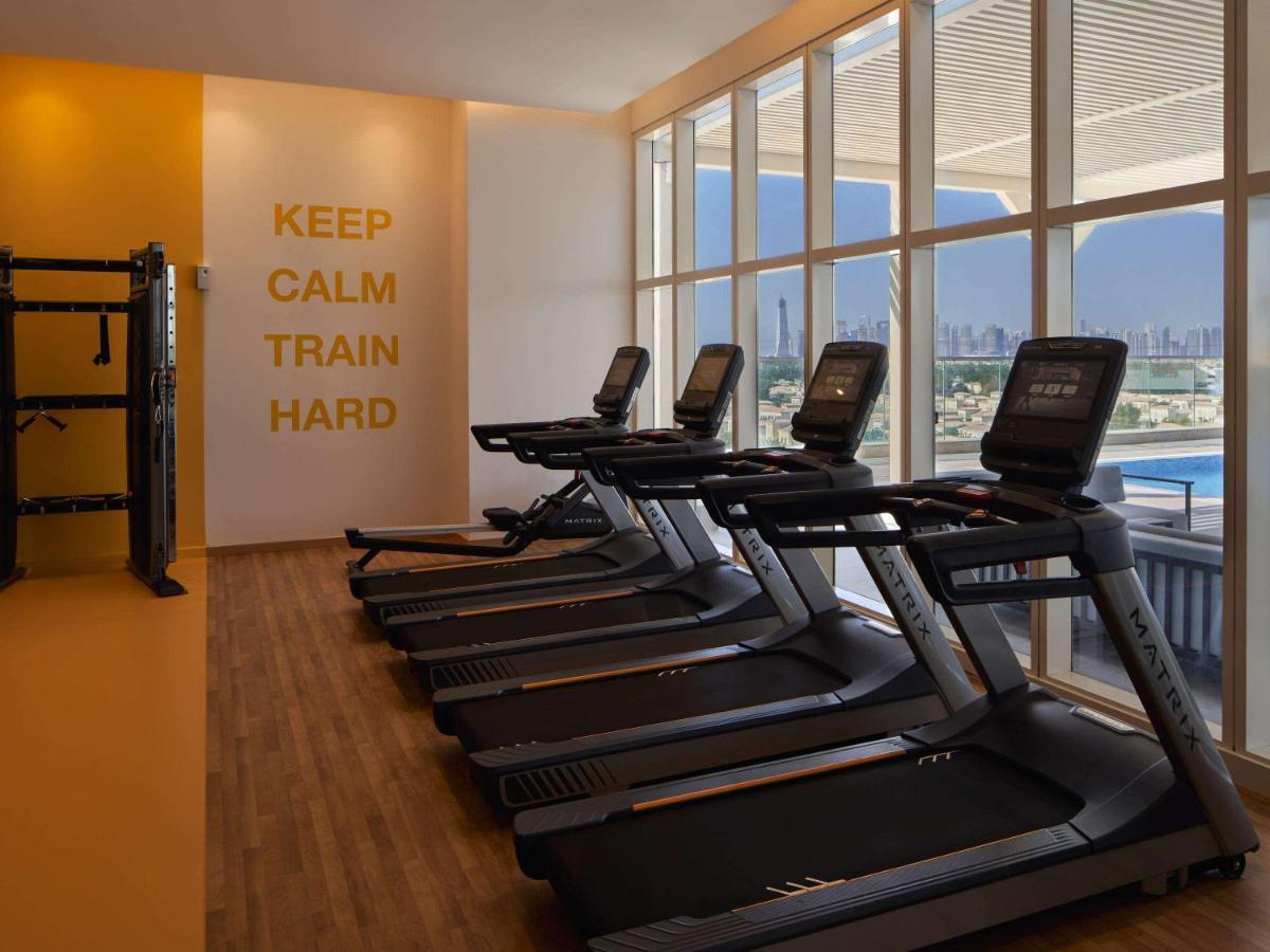 Movenpick Jumeirah Village Triangle Dubai Buitenkant foto The gym at the hotel