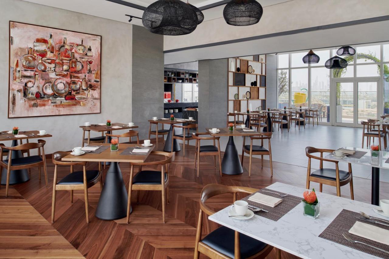 Movenpick Jumeirah Village Triangle Dubai Buitenkant foto The restaurant