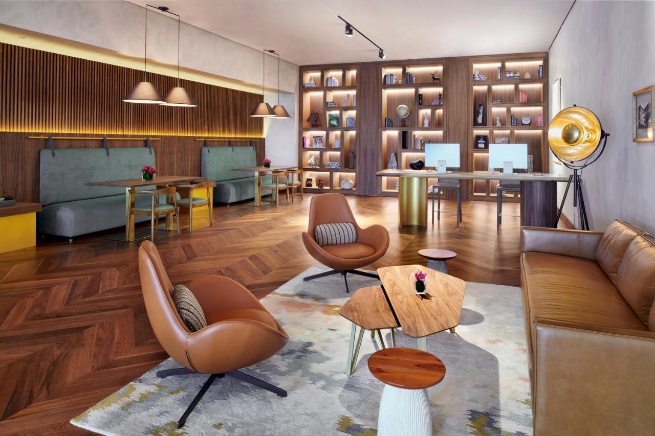 Movenpick Jumeirah Village Triangle Dubai Buitenkant foto The Library at The Hari