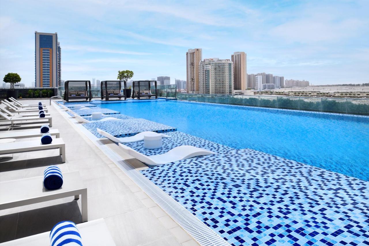 Movenpick Jumeirah Village Triangle Dubai Buitenkant foto Rooftop pool