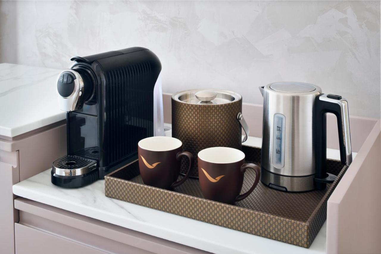 Movenpick Jumeirah Village Triangle Dubai Buitenkant foto A Nespresso coffee machine